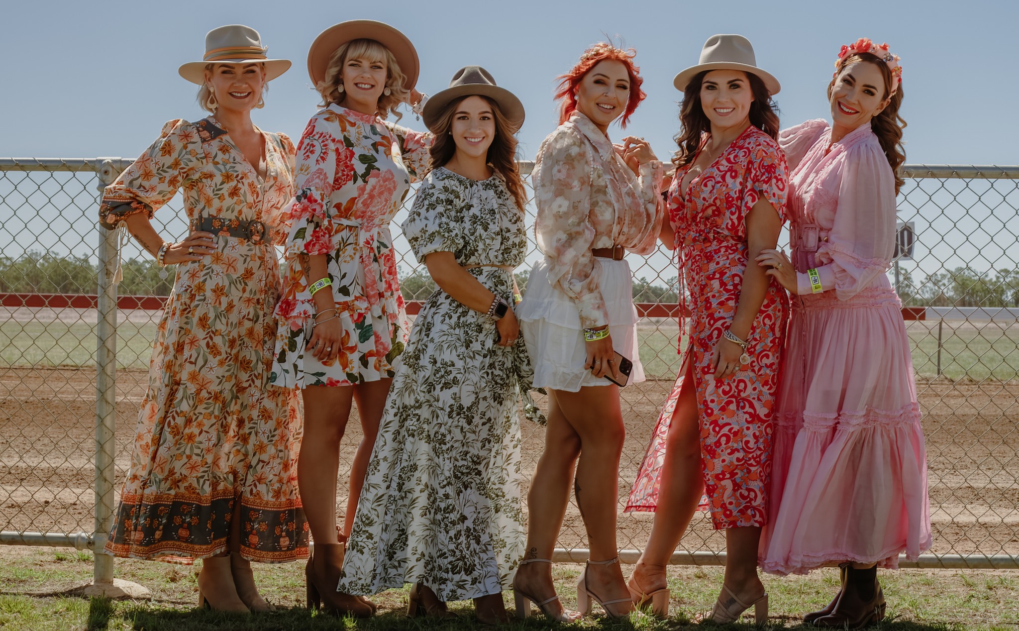 A lineup of fashions on the field women at Dingo Race Day.